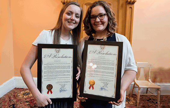 Military youths Molly Frey (left) and Abigail Skinner display one of the resolutions they each received from Ohio Gov. John Kasich and Lt. Gov. Mary Taylor as well as both chambers of the Ohio General Assembly.