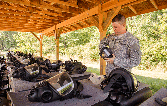 Spc. Kristopher Fries maintains protective masks.