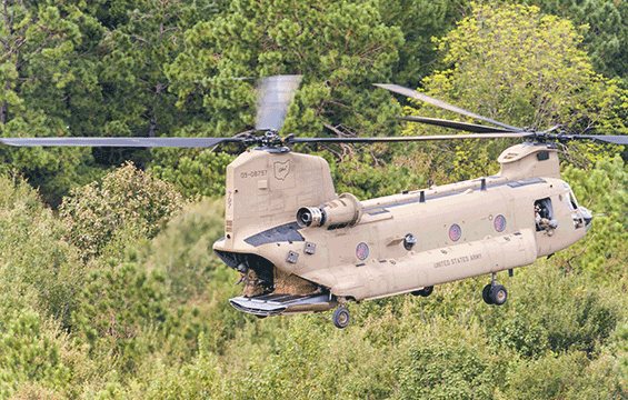 An Ohio Army National Guard CH-47 Chinook helicopter delivers hay.