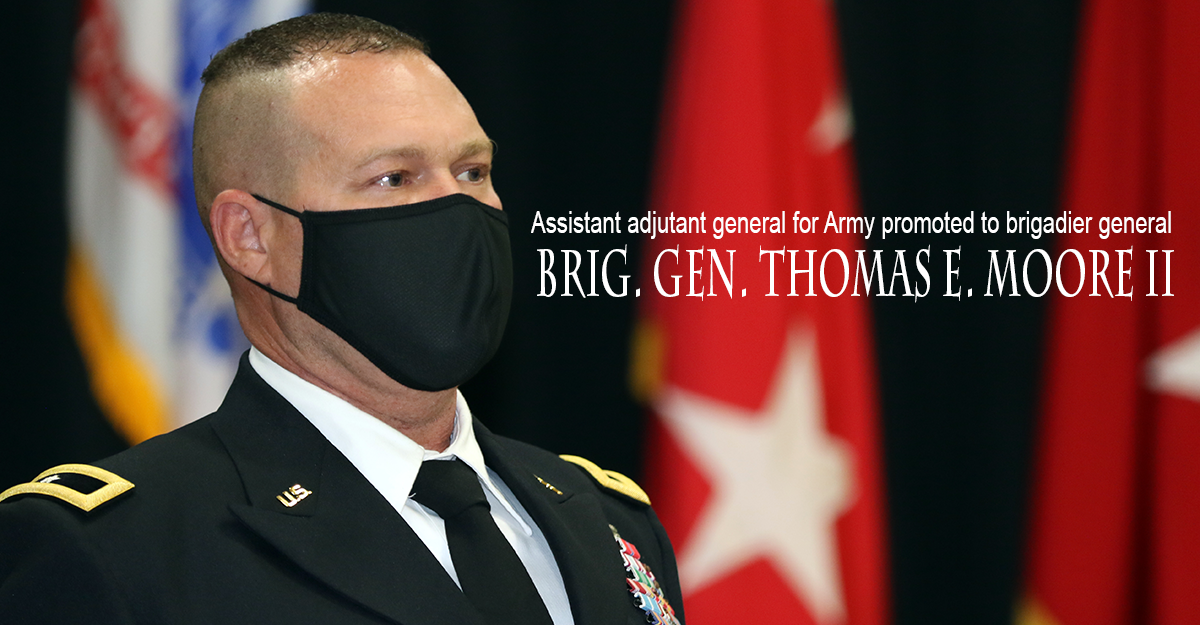 BG Moore in mask with 1 star shoulder and flag.