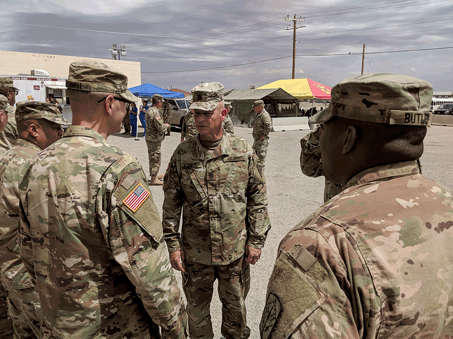 Jones talks with Soldiers outside.