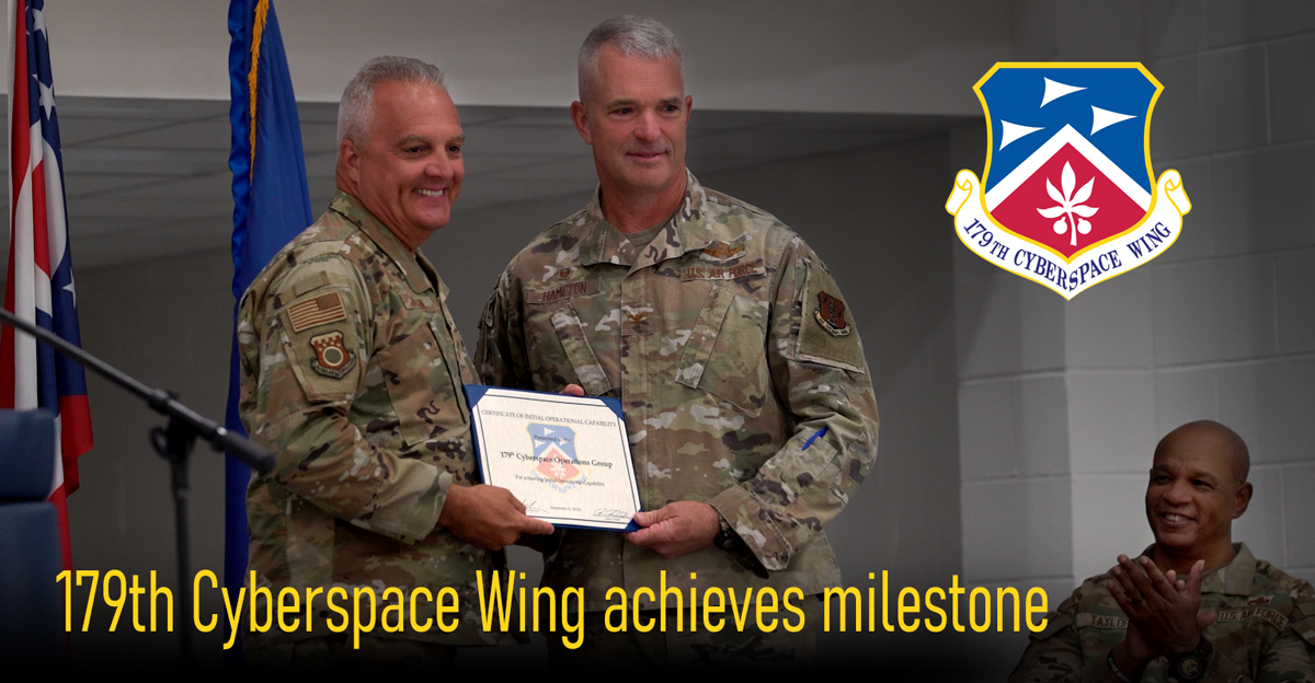 Sr leadership pose for photo while holding certificate.