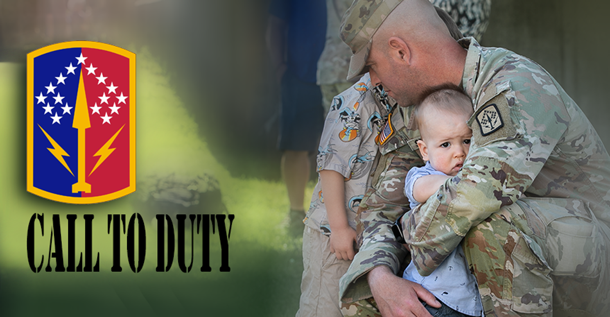 Soldier hugging child