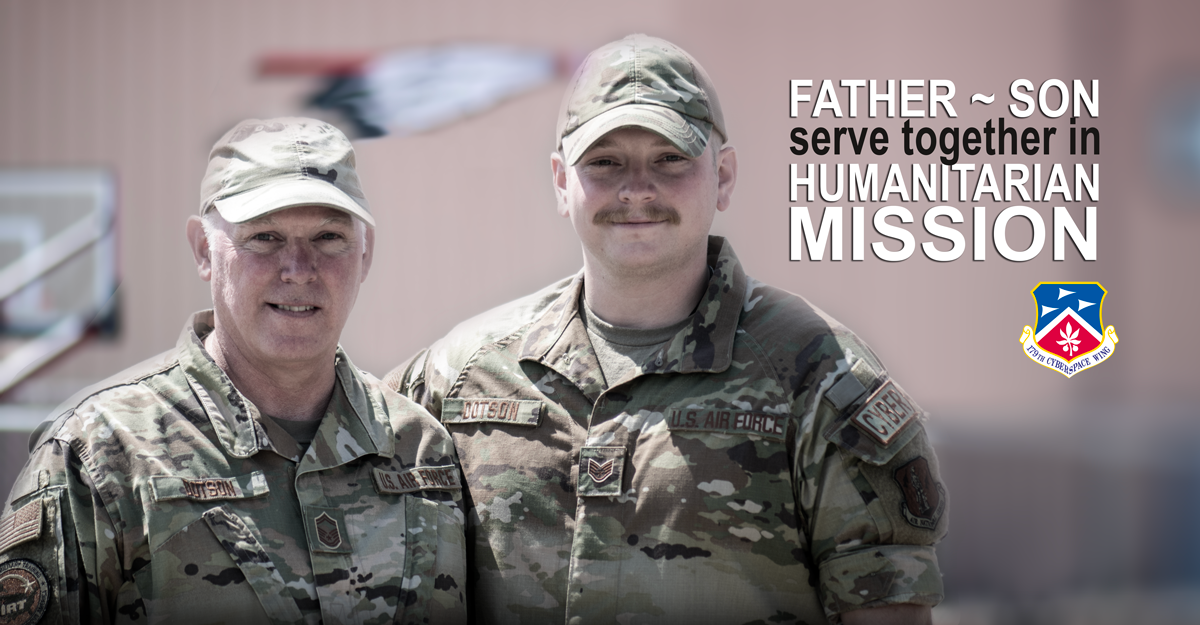 Father and son pose for pic in uniform