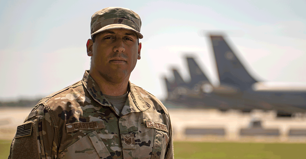 U.S. Air Force Tech. Sgt. Nathaniel Carter, a production controller with the 121st Air Refueling Wing Maintenance Group, stands outside a hangar at Rickenbacker Air National Guard Base, Ohio, Aug. 4, 2019. As a production controller, Carter's job is to coordinate the flight line between the Operations Group and Maintenance.