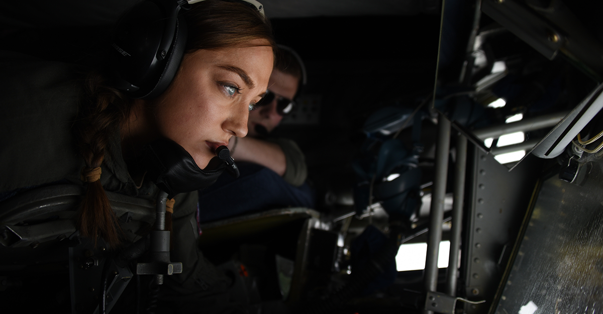 Staff Sgt. Morgan Hall, a boom operator assigned to the Ohio Air National Guard’s 121st Air Refueling Wing, looks out of the boom pod of a KC-135 Stratotanker during a refueling flight.
