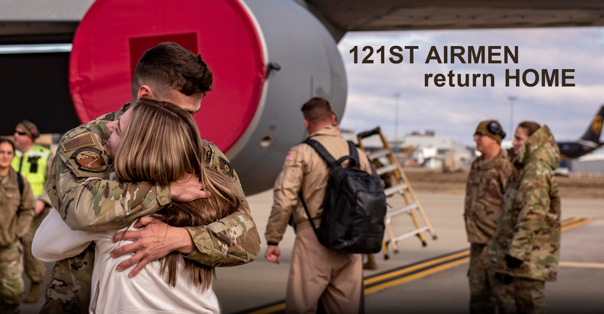 Airman hugs loved one.