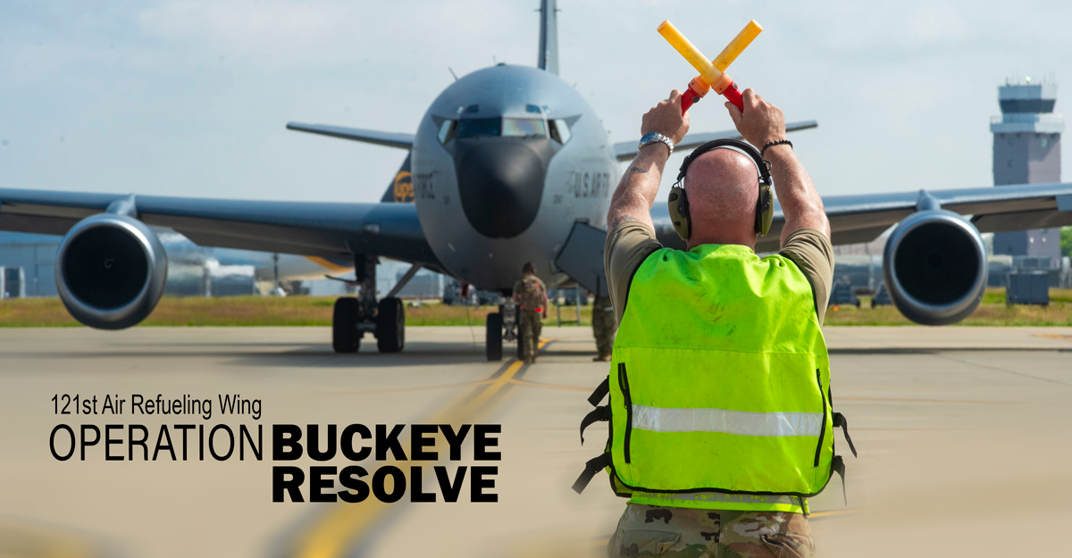 Airman marshals a KC-135 Stratotanker at Rickenbacker Air National Guard Base