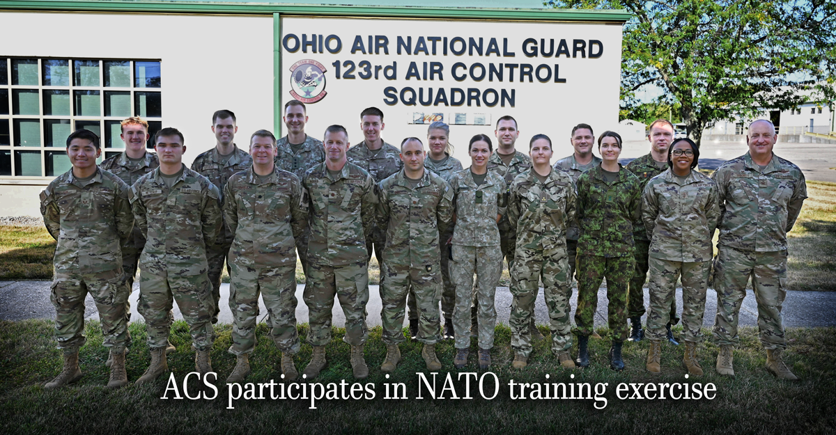 OHANG Airman stand with service members from the United Kingdom, Estonia, Lithuania, and Hungary.