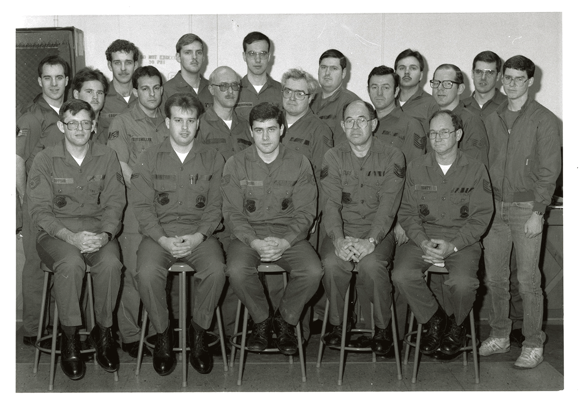 Group of airmen pose for photo. 