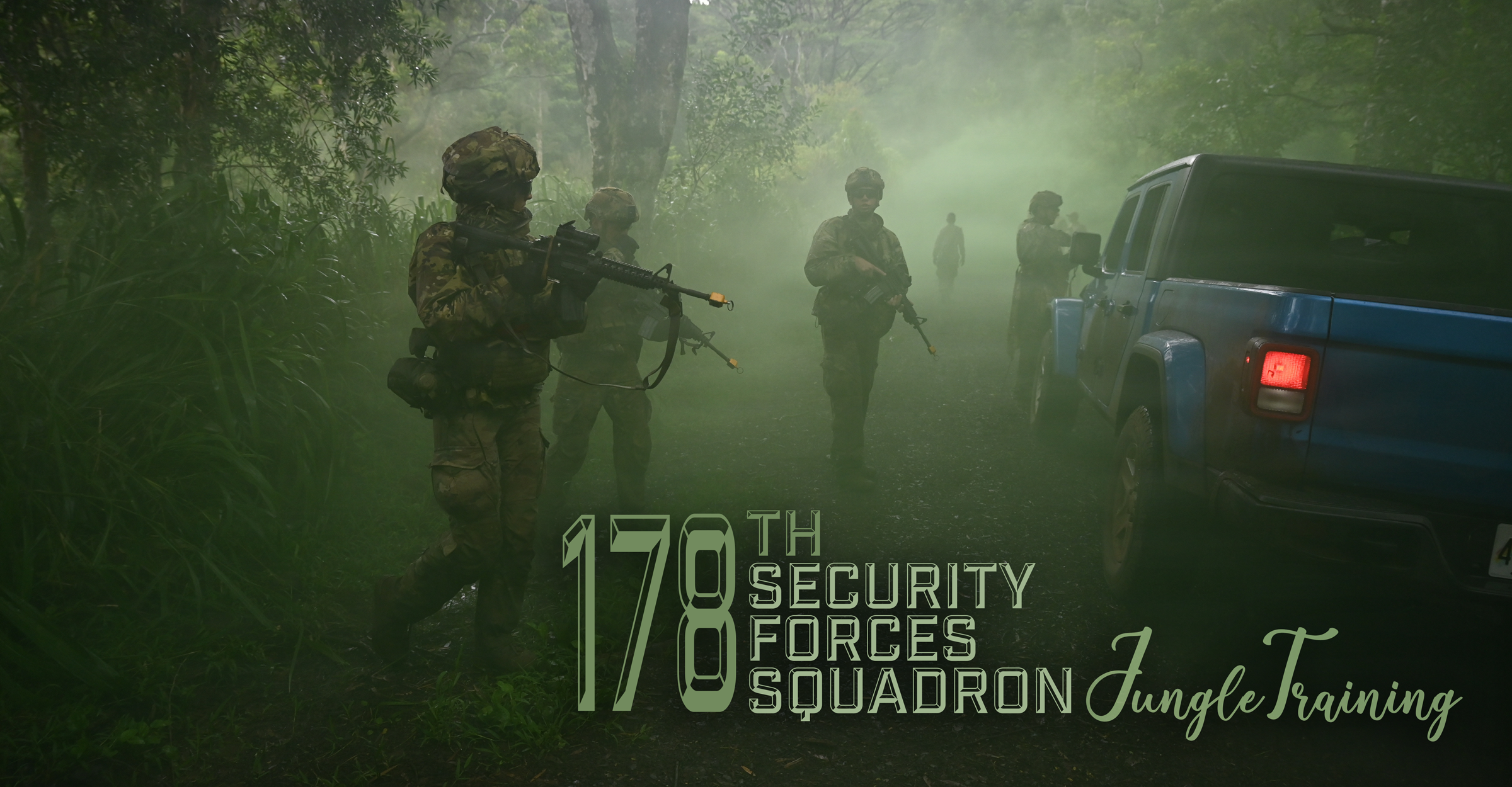 Airmen walking through smoke