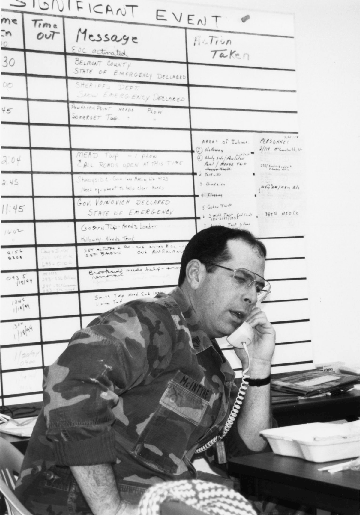 Black and white photo of Sgt. 1st Class Donald McIntyre at desk.