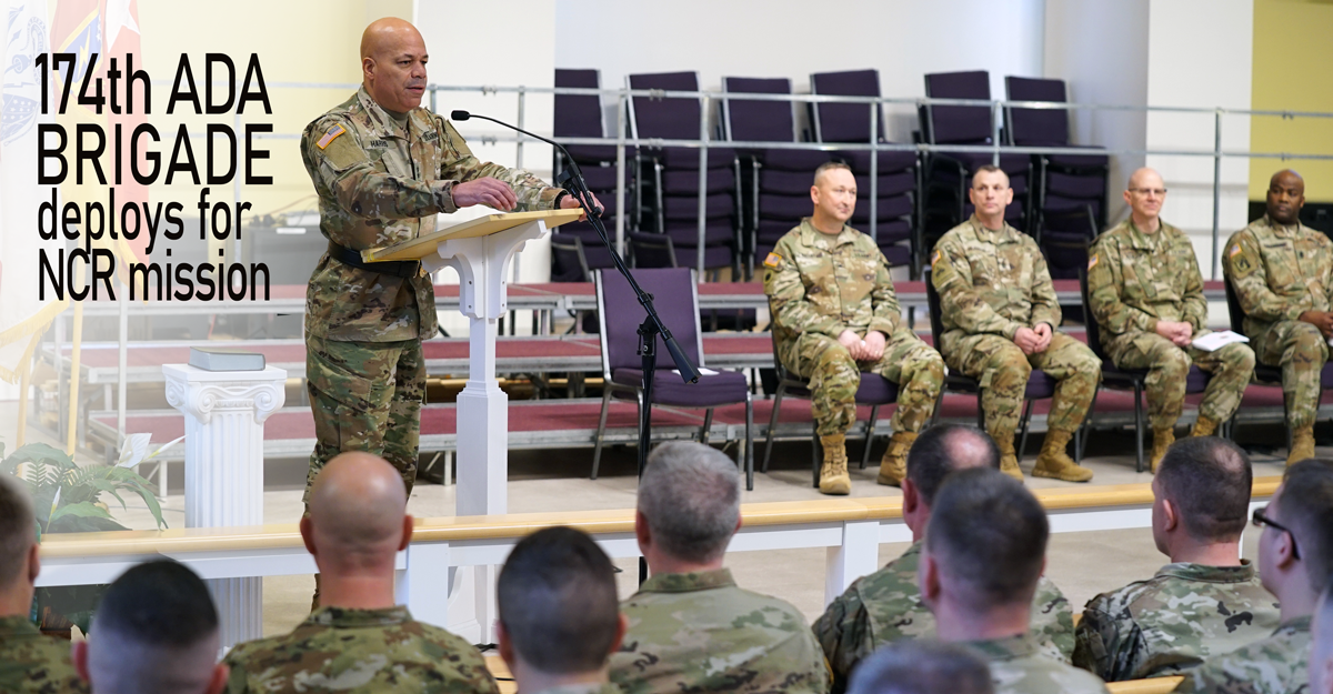 Maj. Gen. Harris at podium addressing Soldiers in auditorium.
