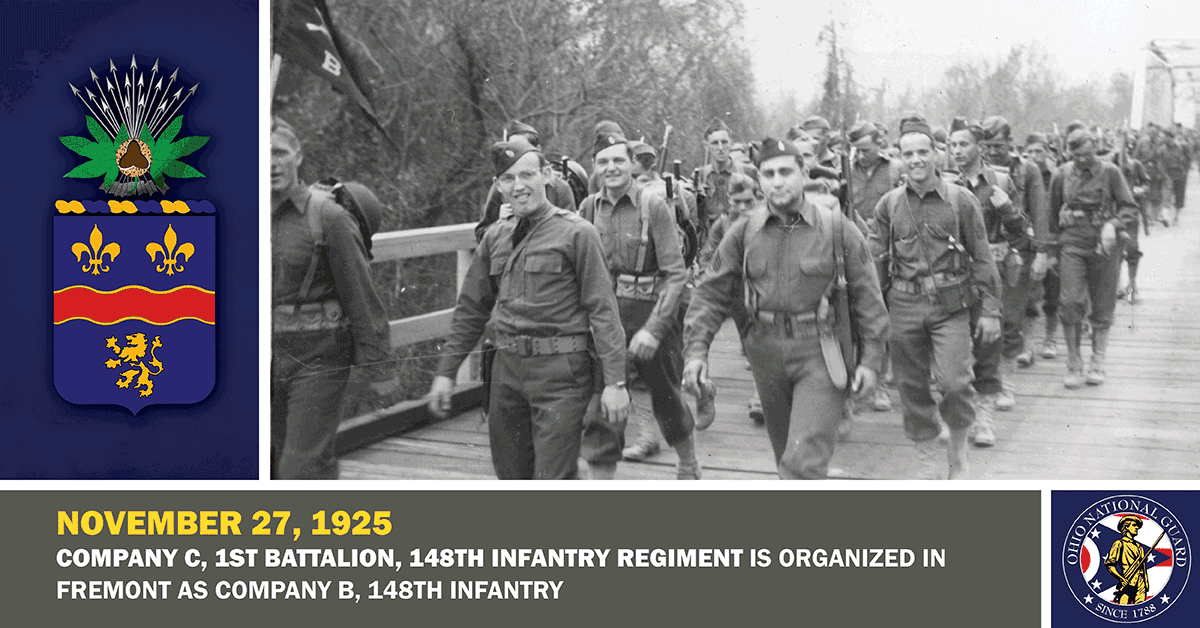 Soldiers cross a bridge in 1941 photo.