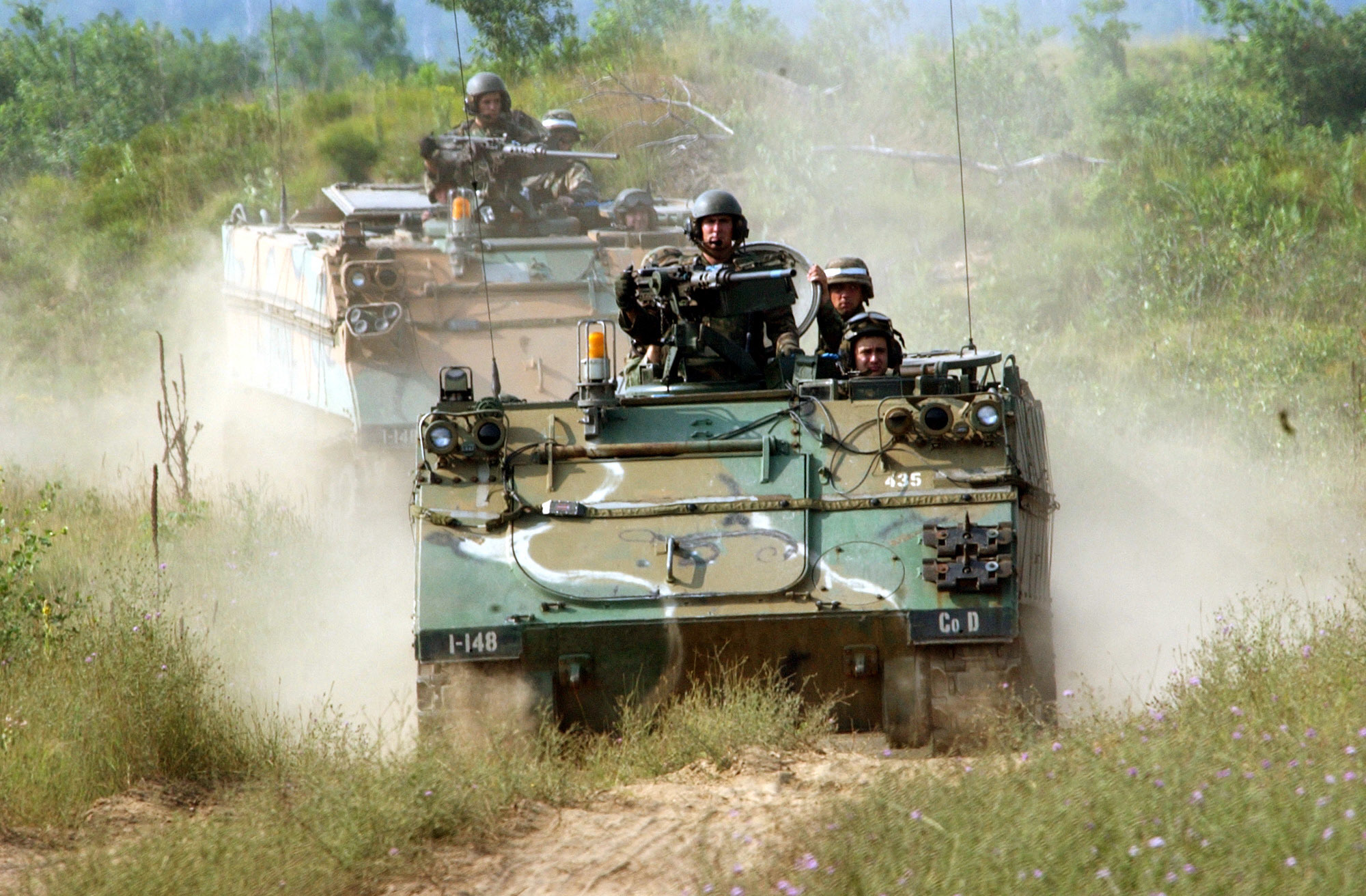 An M113 Armored Personnel Carrier of Company D, 1st Battalion, 148th Infantry, 37th Brigade, 38th Infantry Division moves into position during a platoon live-fire exercise at Camp Grayling Mich., July 2005.