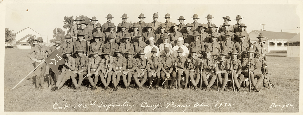 Sepia-tone of troops in rows ffrom 1935.