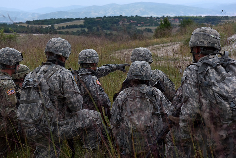 Soldiers kneeling in field from 2018.