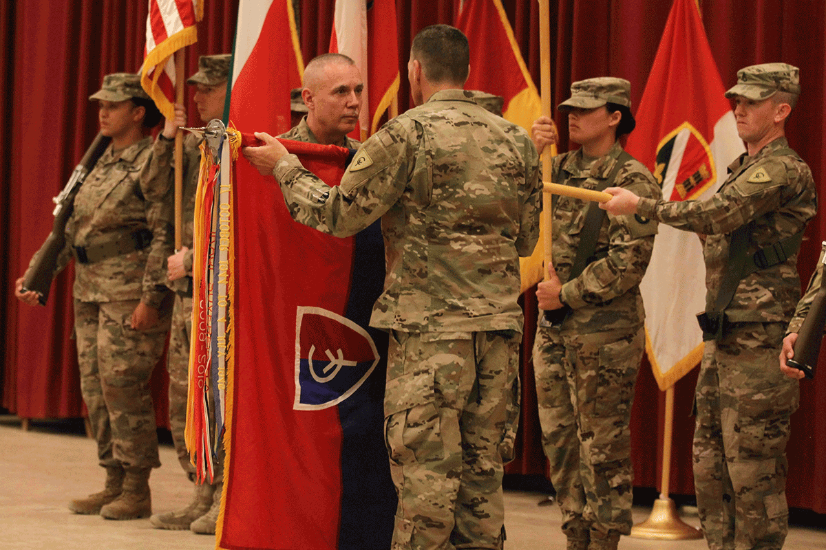 Maj. Gen. Gordon Ellis and Command Sgt. Maj. Dale Shetler uncase the division colors to symbolize the transfer of authority.