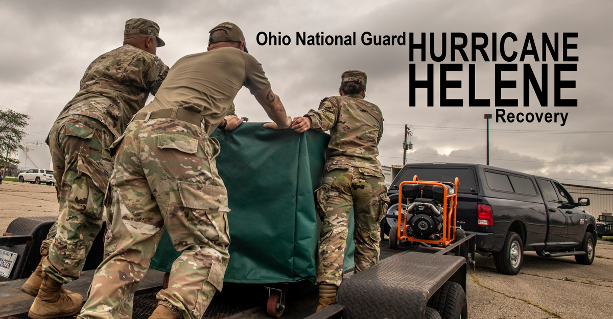 Airmen loading supplies onto trailer.