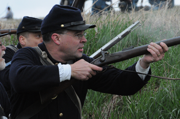 Ohio Air National Guard member Brian McNamara, a Mount Vernon, Ohio, resident, participates in a Civil War re-enactment battle as part of the 41st Ohio Volunteer Infantry Regiment. The Ohio National Guard is commemorating the 150th anniversary of the Civil War this year. (Ohio National Guard Photos/Sgt.1st Class Joshua Mann) 