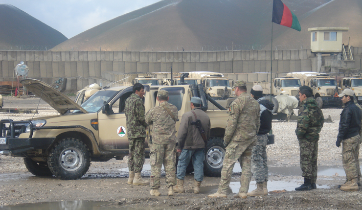 Members of the Afghan National Police with Soldiers from the Ohio Army National Guard's Company C, 1st Battalion, 148th Infantry Regiment, 37th Infantry Brigade Combat Team