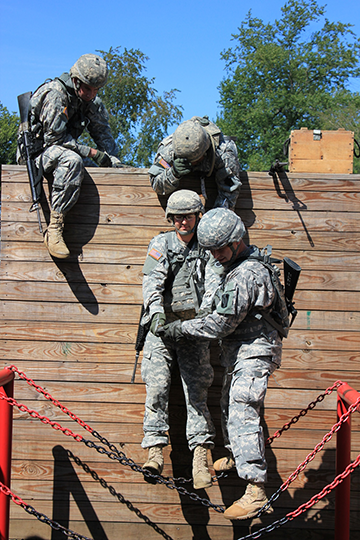 Soldiers in the Reserve Component Warrant Officer Candidate School use teamwork to navigate a task