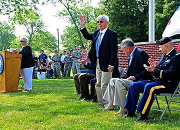 Retired Army Lt. Gen. John S. Crosby waves to crowd