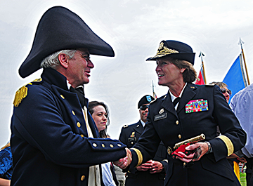 Maj. Gen. Ashenhurst shakes hand in vintage attire