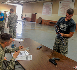 Ohio Army National Guard Sgt. Daniel J. Brautigam completes the M4 carbine clear-disassemble-assemble station.