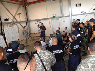 Firefighters from the Ohio Army National Guard’s 5694th Engineer Detachment participate in a training class with firefighters from various European countries' militaries