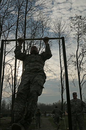 A Soldier conducts pull-ups in the early morning hours of Nov. 7, 2015, at Camp Ravenna Joint Military Training Center in Newton Falls, Ohio. 