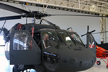 Command Sgt. Maj. István Kriston, command sergeant major of the Hungarian Defence Forces, learns about a UH-60 Black Hawk helicopter.