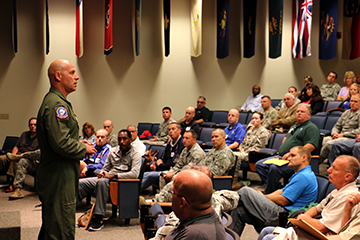 Col. Gary A. McCue, 179th Airlift Wing commander, speaks to attendees.