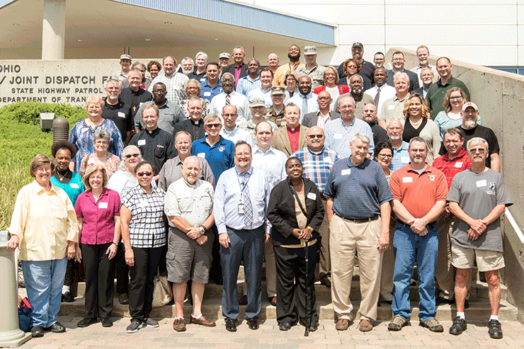 More than 60 civilian clergy members pose for a photo at a symposium organized by the Ohio National Guard and the Department of Veteran Affairs.