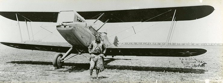 Col. Tom J. Herbert, 37th Division Aviation, stands in front of DH-9 airplane at Camp Perry, Ohio in 1927. Herbert, the first commander of the 37th Division Aviation, later served as Ohio governor from 1947 to 1949. 