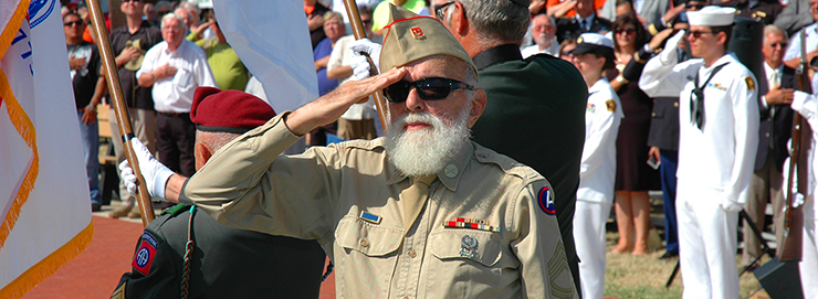 World War II veteran Lloyd Boyer salutes during the First Shot Ceremony.
