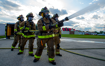 Ohio Army National Guard firefighters with the 295th and 296th Engineer Detachments train with the 513th Engineer Detachment in a live burn exercise in early morning.