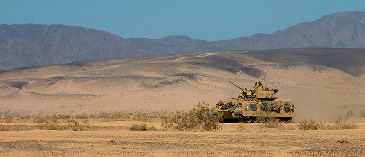 An M3 Bradley Cavalry Fighting Vehicle moves across the Mojave Desert.