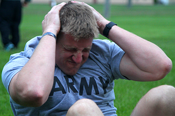 Staff Sgt. Anthony Henner, noncomissioned officer representing the Wisconsin National Guard, executes situps.