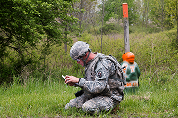 Sgt. John Finken of the Iowa Army National Guard does on the spot correction of his plotted points on the land navigation course.