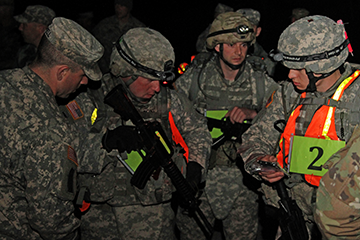 Soldiers prepare their gear for the 12-mile ruck march event.