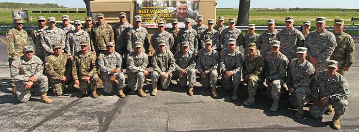 Competitors pose with their sponsors and state command sergeants major after an awards ceremony for the Region IV Best Warrior Competition.
