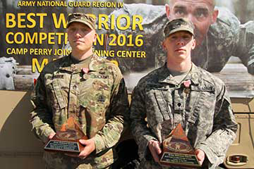 Indiana Army National Guard Staff Sgt. Logan Gehlhausen (left) and Iowa Army National Guard Spc. Dakota VanBrocklin for winning the overall noncomissioned officer and Soldier categories show their awards.
