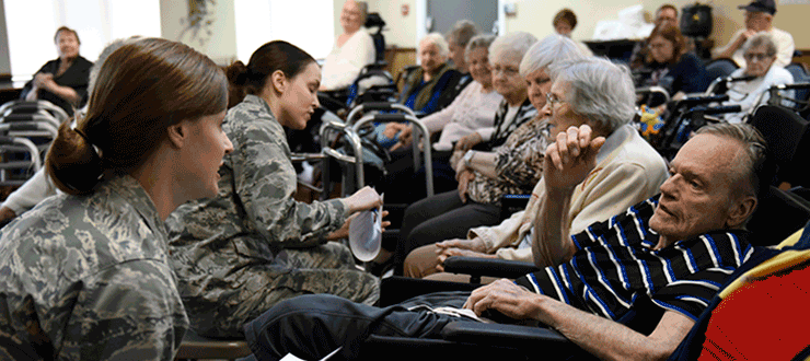 Airmen meeting with veterans home residents.
