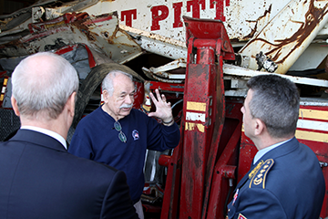 Warren E. Motts (center), founder and executive director of Motts Military Museum, discusses military history with Lt. Gen. Jovica Draganić (right), Serbian Armed Forces deputy chief of general staff, and Djerdj Matkovic, Serbian Ambassador to the United States.