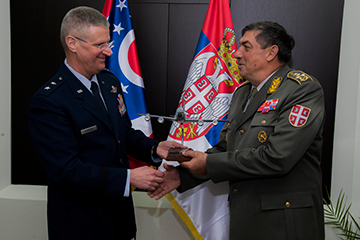 Bartman (left) exchanges gifts with Gen. Ljubiša Diković, chief of staff of the Serbian Armed Forces.