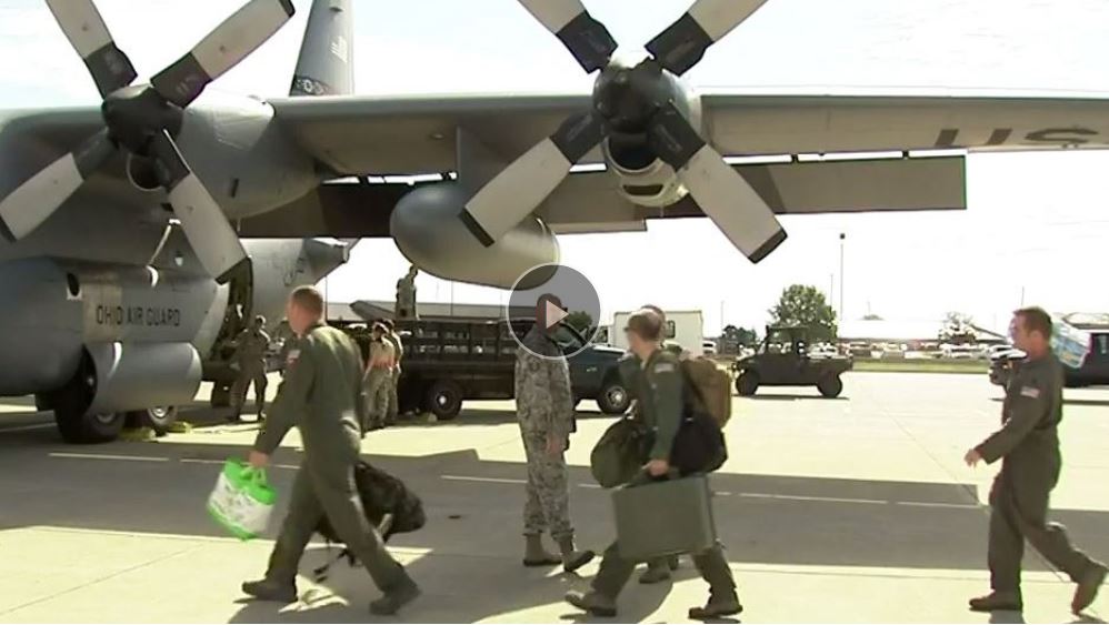 Airmen walking to board C-135.