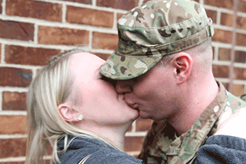 Spc. Michael Knisley, a power generator equipment specialist, kisses his wife goodbye.