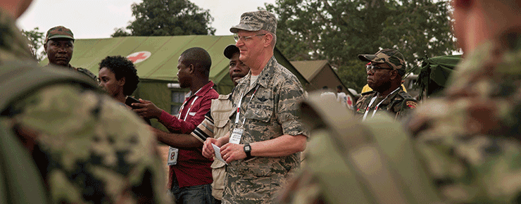 Maj. Gen. Mark E. Bartman (center), Ohio adjutant general, speaks with members of the Angolan Armed Forces, Serbian Armed Forces and the Ohio National Guard.
