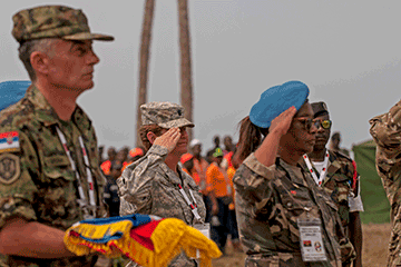 U.S. Army Lt. Col. Jill McLoughlin, a preventative medicine officer with the Ohio National Guard, represents the United States in the exchanging of flags during the closing ceremony.
